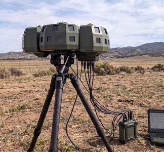 Rheinmetall's Skyblazer wide area sensor on a tripod – Representative Skyblazer 360° image on AI-generated background
